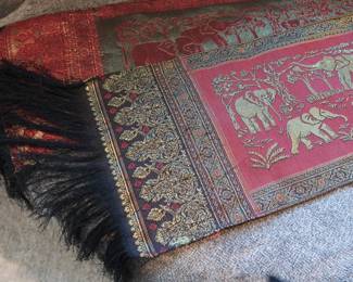 Thai Elephant Tapestry Runner – Long Format
Woven textile featuring gold elephants and traditional Thai motifs. Likely poly-silk blend. Beautiful as a table runner or wall accent.