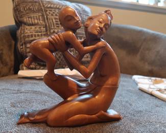 Elegant and expressive wood carving depicting a mother embracing her child.
Intricate detailing, especially in the hair and faces
Likely Balinese or African origin
Smooth finish and solid wood construction
Approx. 10–12” tall