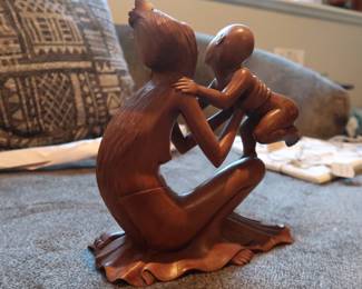 Elegant and expressive wood carving depicting a mother embracing her child.
Intricate detailing, especially in the hair and faces
Likely Balinese or African origin
Smooth finish and solid wood construction
Approx. 10–12” tall