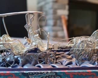 Decorative miniature ox and horse-drawn carts crafted with fine metal filigree-style detailing. These pieces were acquired during the world travels of a retired couple and showcase ornate design and cultural charm. Not silver, but still striking in appearance—perfect for display or resale in home décor or vintage markets.
As a Set: $20–25
Individually: $10–15 each