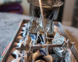 Decorative miniature ox and horse-drawn carts crafted with fine metal filigree-style detailing. These pieces were acquired during the world travels of a retired couple and showcase ornate design and cultural charm. Not silver, but still striking in appearance—perfect for display or resale in home décor or vintage markets.
As a Set: $20–25
Individually: $10–15 each