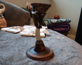 Hand-Carved Elephant Candle Holder – Tribal Design
Decorative elephant-themed candle holder with carved geometric pattern. Likely hand-crafted in Africa or inspired by traditional African art. Material appears to be resin or wood composite. Collected during travels in Africa – artisan piece