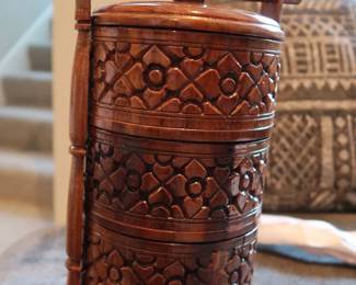 Hand-Carved Wooden Stacking Tiffin
Traditional tiered food carrier from Southeast Asia or India. Intricately carved hardwood with stacking compartments and locking pin. Beautiful global décor piece.