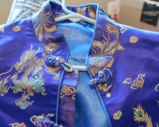 Embroidered Chinese Brocade Jacket – Dragon Motif
Traditional style short jacket with gold dragon embroidery and frog button closures. Likely satin/poly blend.