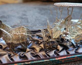 Decorative miniature ox and horse-drawn carts crafted with fine metal filigree-style detailing. These pieces were acquired during the world travels of a retired couple and showcase ornate design and cultural charm. Not silver, but still striking in appearance—perfect for display or resale in home décor or vintage markets.
As a Set: $20–25
Individually: $10–15 each