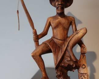 Striking wood sculpture of a fisherman holding a rod and a large fish, with intricate details and a strong sense of movement.
Likely Balinese or Southeast Asian folk art
Hand-signed on the base
Excellent condition with original rod intact
Approx. 12–14" tall