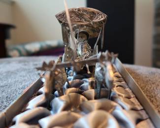 Decorative miniature ox and horse-drawn carts crafted with fine metal filigree-style detailing. These pieces were acquired during the world travels of a retired couple and showcase ornate design and cultural charm. Not silver, but still striking in appearance—perfect for display or resale in home décor or vintage markets.
As a Set: $20–25
Individually: $10–15 each