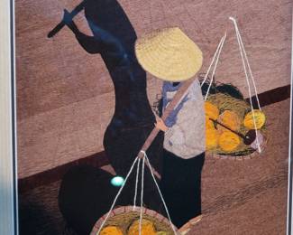 Vietnamese Silk Thread Art – Framed
Hand-stitched silk thread piece depicting a traditional fruit vendor with baskets. Beautiful detail, protected under glass with bamboo-look frame.