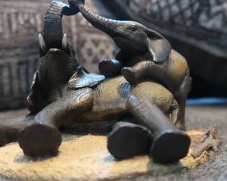 "Playful Elephants" Resin Figurine
Charming sculpture of two elephants in a joyful, affectionate pose on a textured base. Detailed and expressive, made of resin with a dark bronze-tone finish.
Approx. 6" wide, 5" tall
Solid and well-made