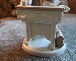Lladro Porcelain Figurine – “Nap Time at School”
Authentic Lladro figurine, handmade in Spain. Features a young student dozing at a desk with books and a satchel. Glossy pastel finish, excellent detail. Marked on base.