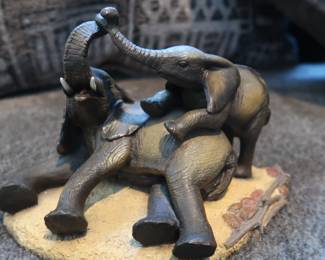 "Playful Elephants" Resin Figurine
Charming sculpture of two elephants in a joyful, affectionate pose on a textured base. Detailed and expressive, made of resin with a dark bronze-tone finish.
Approx. 6" wide, 5" tall
Solid and well-made