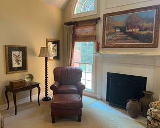Leather chair and ottoman by Pearson, floor lamp, artwork, side table, fire screen