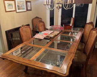 Solid wood and glass dining room table with chairs