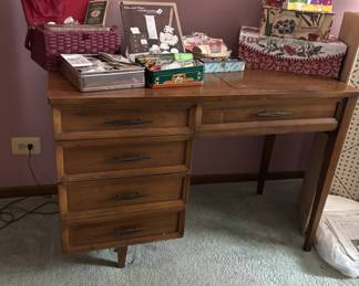 Vintage sewing table full of notions.