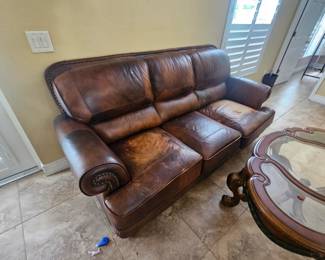 The three piece located at 1962 Crane Creek boulevard distressed leather
( yes supposed to look that way) leather look very comfortable. The set includes the sofa chair and ottoman $800 which is half of what it was when we had the sale.