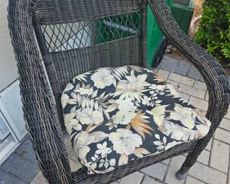 Plastic ratttan accent chair with cushion. $25