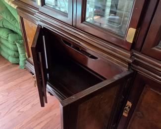 #112	China Cabinet w/4  glass doors & 2 wood doors w/1 drawer & 1 shelf each side w/brass Accents and lighted - ( 2 glass shelves  w/plate rack- Asian Style) - 64x17.5x31-82 - You Move 2 pieces	 $275.00 
