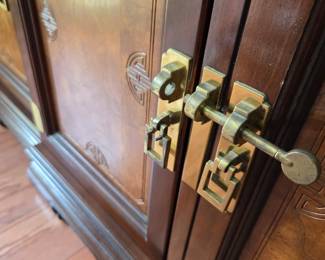 #112	China Cabinet w/4  glass doors & 2 wood doors w/1 drawer & 1 shelf each side w/brass Accents and lighted - ( 2 glass shelves  w/plate rack- Asian Style) - 64x17.5x31-82 - You Move 2 pieces	 $275.00 
