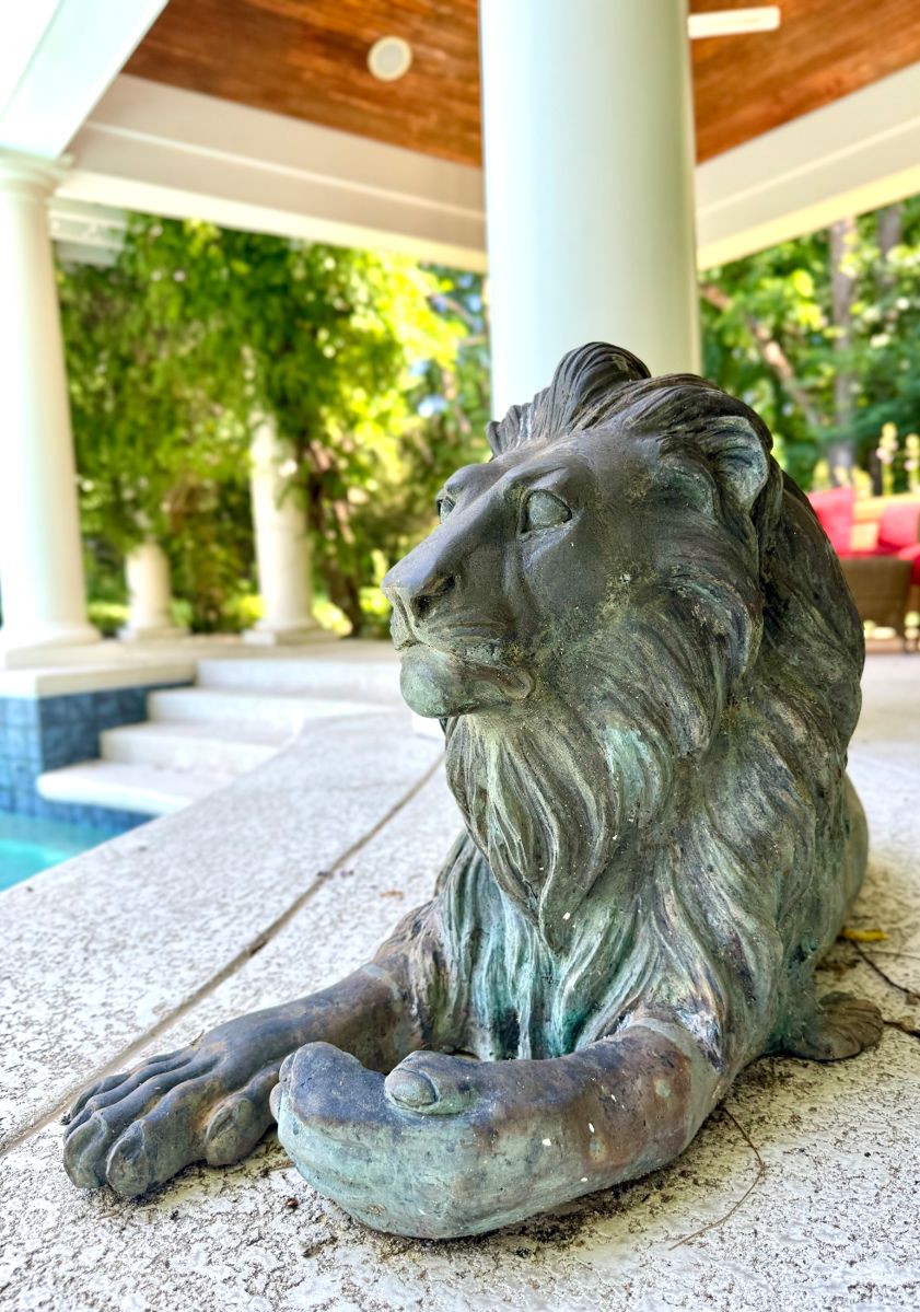 $1500/Each, Two available. Bronze lion at rest. 17" x 35".
