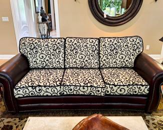 $800. Dark leather couch with nail head trim and brand new cushions. 39" x 87" x 38" (to top of cushion).