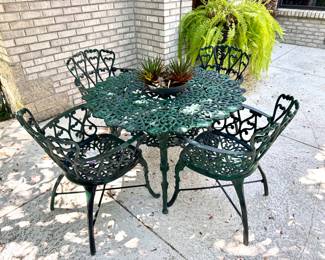$500. Melton craft cast aluminum table and 4 chairs with green finish. Table 40" diameter