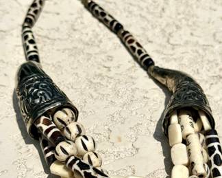 $80; bone and metal necklace from Zanzibar