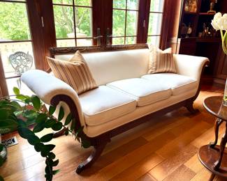 (SOLD; 3 cushion sofa with scrolled arms, intricate carved wood trim and legs; 73x34x32) (SOLD; pair of silk, striped throw pillows)