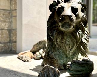 SOLD; Bronze lion at rest; 17" x 35"