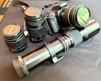 L-R ($120; Canon EFS 18-55mm lens) ($120; Canon EFS 55-250mm lens) ($300; Canon camera)  ($100; Samyang lens 35-500mm)