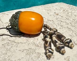 $70; Tibetan amber pendant with horn tassel beaded necklace
