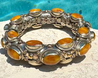 Antique Tibetan amber and sterling silver bracelet. Shop fine jewelry in person for pricing.