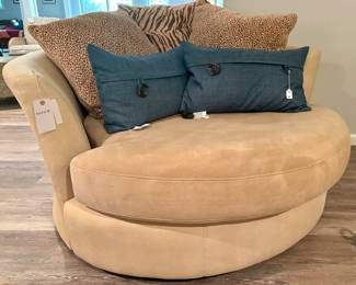 (SOLD; swivel pod chair with curved back and 3 animal print pillows; 57"dx30"h)  (SOLD; blue button pillows)