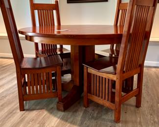$650. Mission style table with unique pedestal base and 4 chairs. 52" diameter x 30.5" h