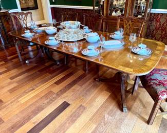 $1500 Thomasville mahogany dining room table with two leaves, inlaid trim, pedestal base and clawfoot legs; 70L x 44W x 29H. Leaves are each 20 inches which extends the table to a full 110 inches long.