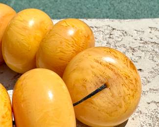 $300; Bakelite Amber, large strung beads from India