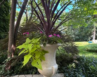 $80. Resin urn with plants. 27" h