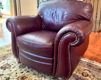 $1000. Oversized dark leather chair with nail head trim. 45" x 34" x 37" tall