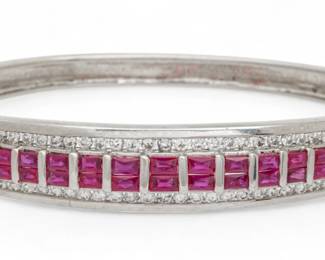 Lot 44 | 18K White Gold, Ruby And Diamond Bangle Bracelet W 2.3" 29 g