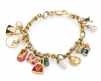 Lot 36 | Italy 14K Yellow Gold Charm Bracelet, 13 Charms L 8" 22 g