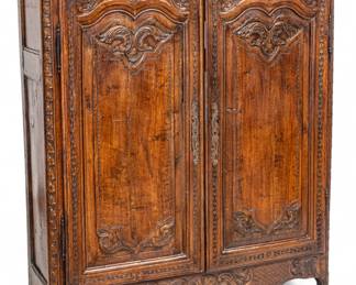 Lot 1095 | Country French Carved Walnut Diminutive Armoire, 19th Cent., H 62.5" W 52.5" Depth 17.5"