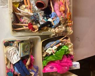 Boxes of Barbie and clothes
