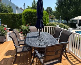 wrought iron oval patio table and 6 iron/wicker chairs