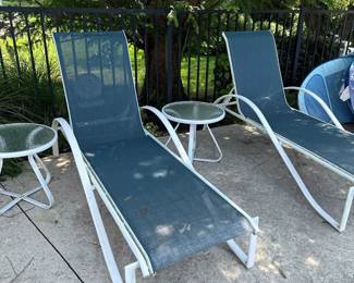 white iron/mesh lounge chairs with glass end tables