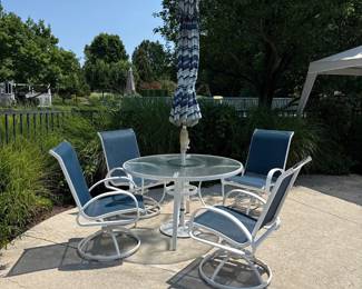white iron/glass round patio table and 4 swivel chairs