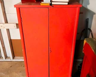 This is an antique painted sheet music cabinet