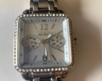 Citizen women's Eco-Drive - mother of pearl dial with square stainless-steel case. 3-hand model with day to day also features luminous hour and minute hands