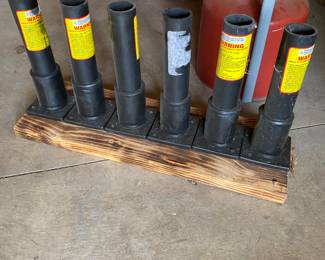 Firework mortar tubes mounted on a wooden base