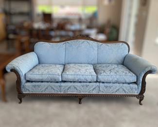 Comfy plush parlor sofa - nicely carved wood frame
