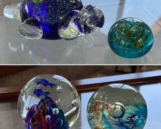 Several glass paperweights