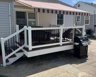 Electric awning; vinyl railing; decking
